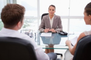 lawyer at desk listening to clients: SEO Legal Marketing Blog